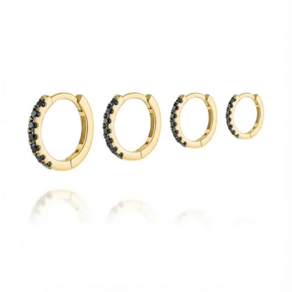 Hoop earrings set with varying sizes of black diamonds in 14-karat gold